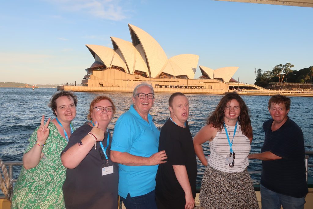 Leisure Options staff on tour with travellers with the Sydney Opera House in the background.