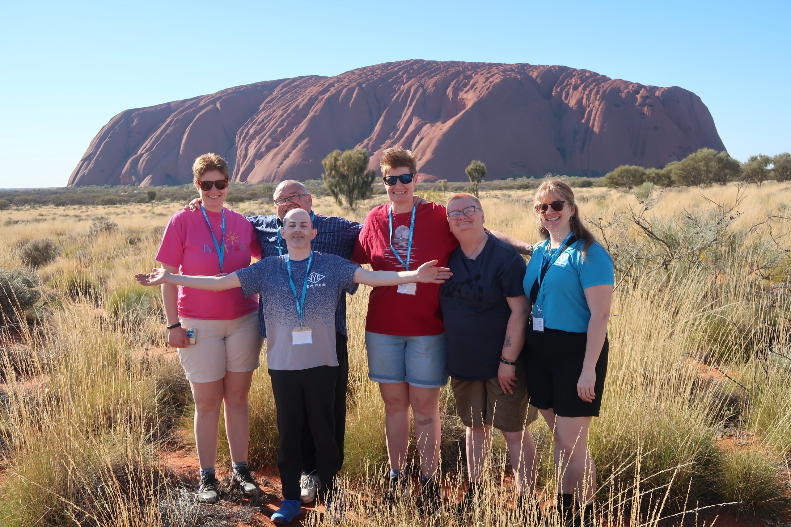Small group with disabilities travelling with Leisure Options, visiting Uluru.
